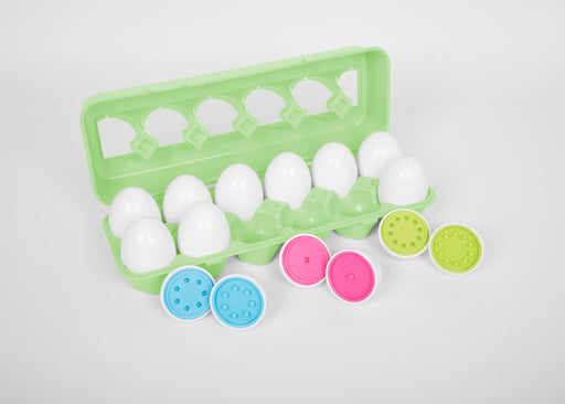 A plastic egg box containing a dozen eggs which each pull apart to reveal brightly coloured centres with numbers to match with their corresponding pegs and holes.