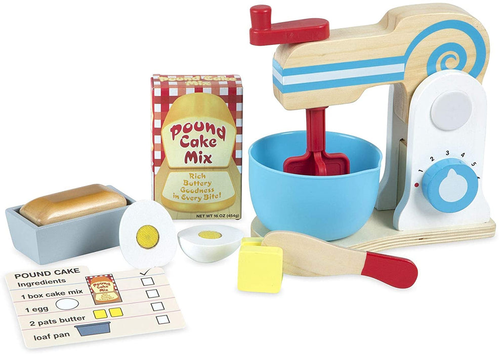 Our Wooden Make-a-Cake Mixer Set is a hand-crank mixer containing 11-pieces including a mixer, bowl, sliceable wooden eggand butter, loaf, cake tin, pretend cake mix box, cake pan, wooden knife,and recipe card.