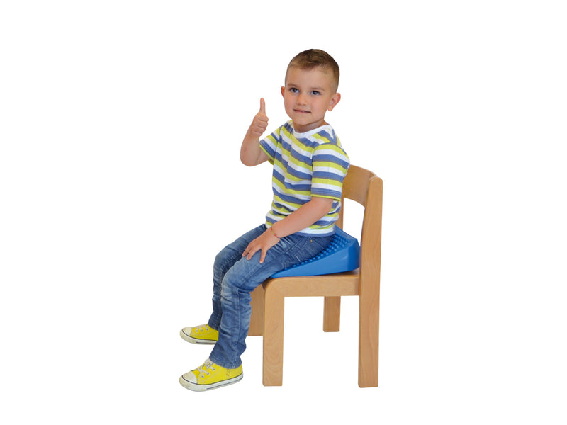 Child using Movin' Sit Junior cushion for active seating and improved posture