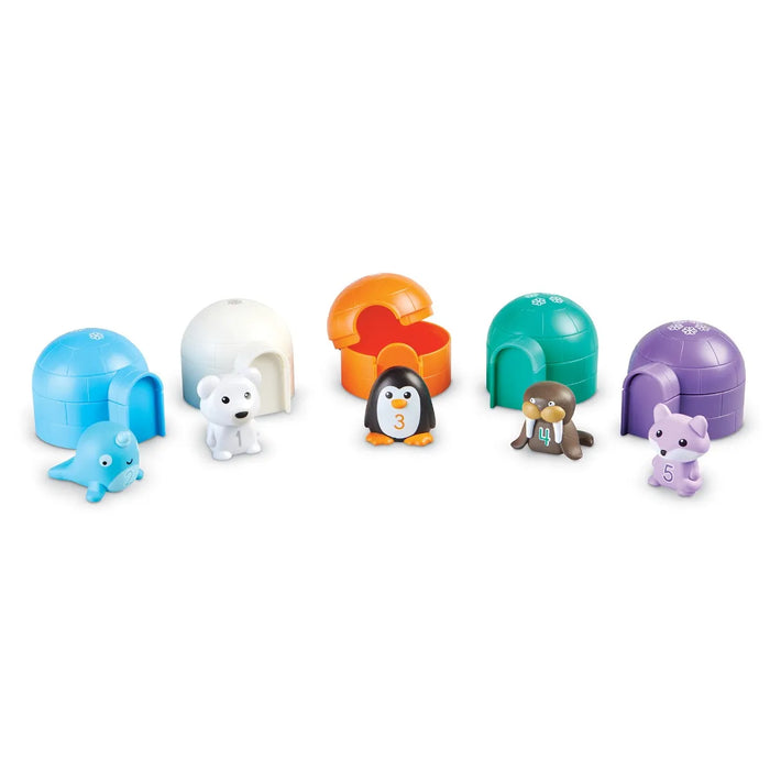 All 5 of the Sort & Seek Polar Animals. Each animal is standing outside their own igloo house